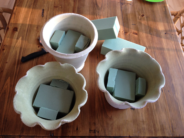 filling pots with dried hydrangeas