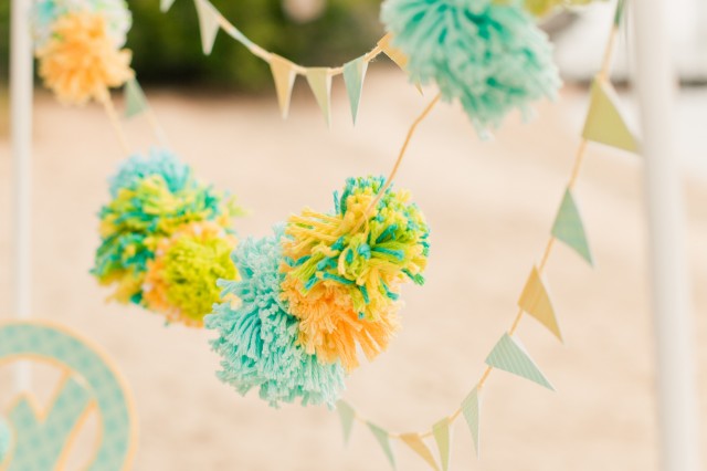 up close yarn pom banner