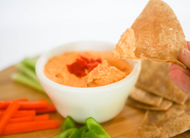 Fresh spicy red pepper hummus with warm tortillas