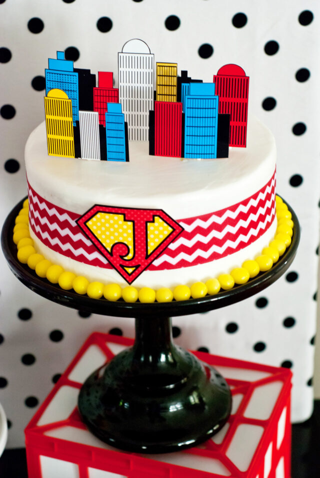 Vintage comic book birthday party setup with colorful superhero desserts and printable decor