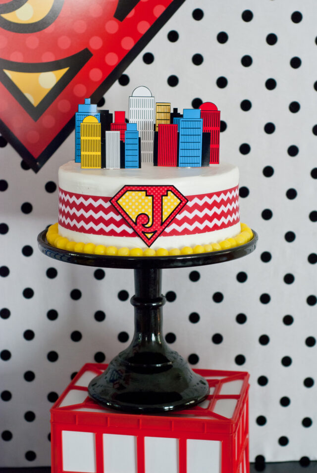 Vintage comic book birthday party setup with colorful superhero desserts and printable decor