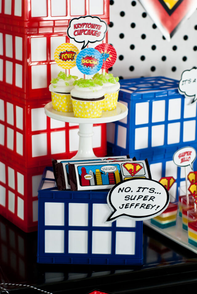 Vintage comic book birthday party setup with colorful superhero desserts and printable decor