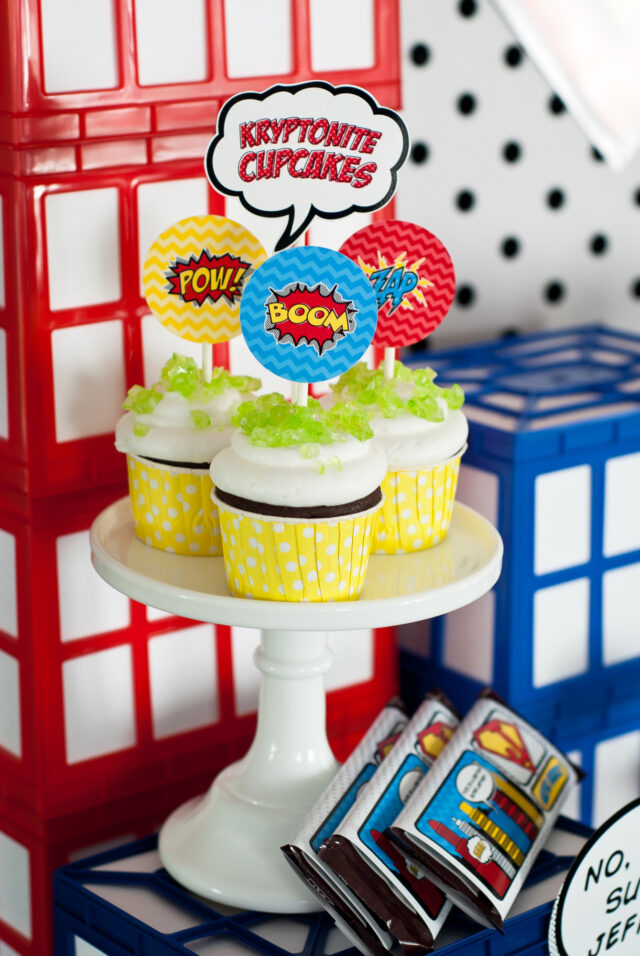 Vintage comic book birthday party setup with colorful superhero desserts and printable decor