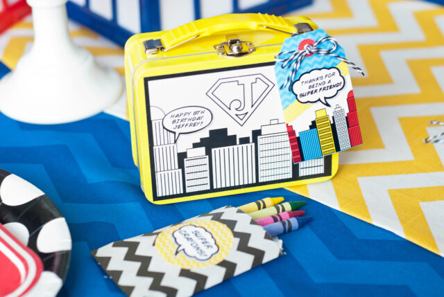 Vintage comic book birthday party setup with colorful superhero desserts and printable decor