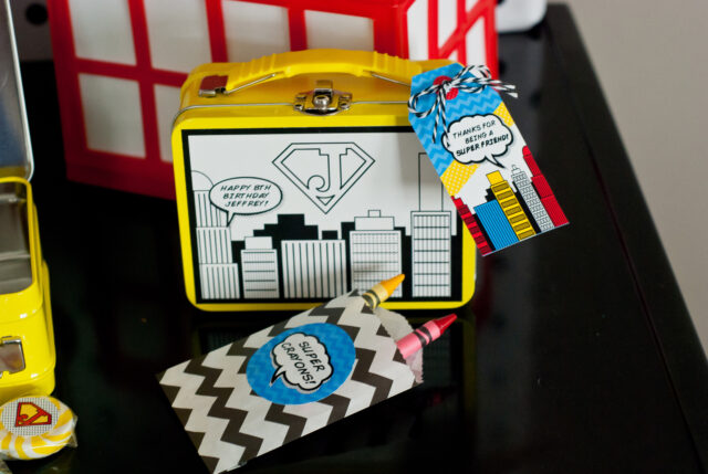 Vintage comic book birthday party setup with colorful superhero desserts and printable decor
