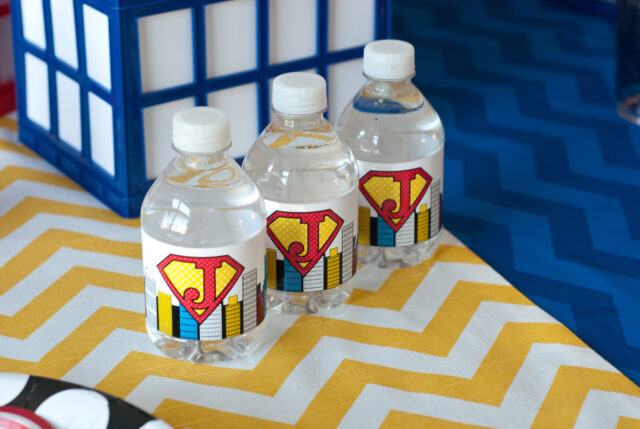 Vintage comic book birthday party setup with colorful superhero desserts and printable decor