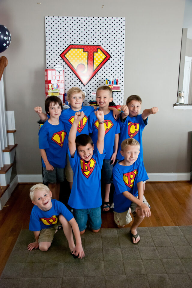 Vintage comic book birthday party setup with colorful superhero desserts and printable decor