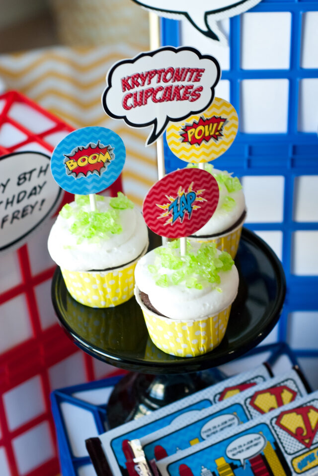 Vintage comic book birthday party setup with colorful superhero desserts and printable decor