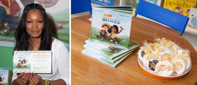 Garcelle Beauvais holding anders ruff custom invitation for I Am Mixed Launch Party