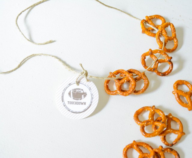 Party logo on pretzel necklace