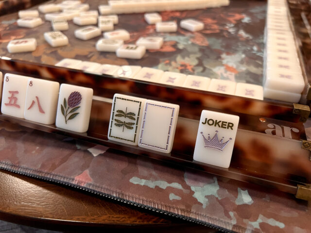 Brownstone Bloom Mahjong tiles by Anders Ruff x Indigo Pruitt Design Studio, featuring botanical details, a moody color palette, soft lavender and mauve accents, and elegant hand-finished designs inspired by Brooklyn brownstones.